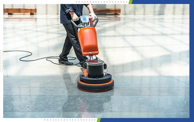 professional worker cleaning floor with cleaning equipment