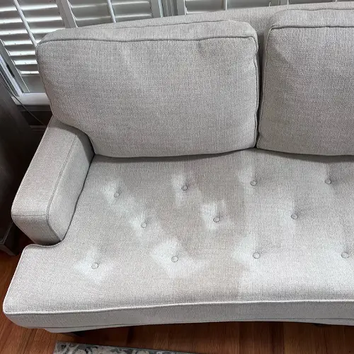 A whitish dirty sofa